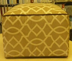 Yellow Upholstered Ottoman with Brown Trim